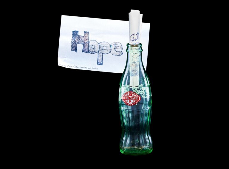 Coke® Bottle With “Hope” Notecard Inside
