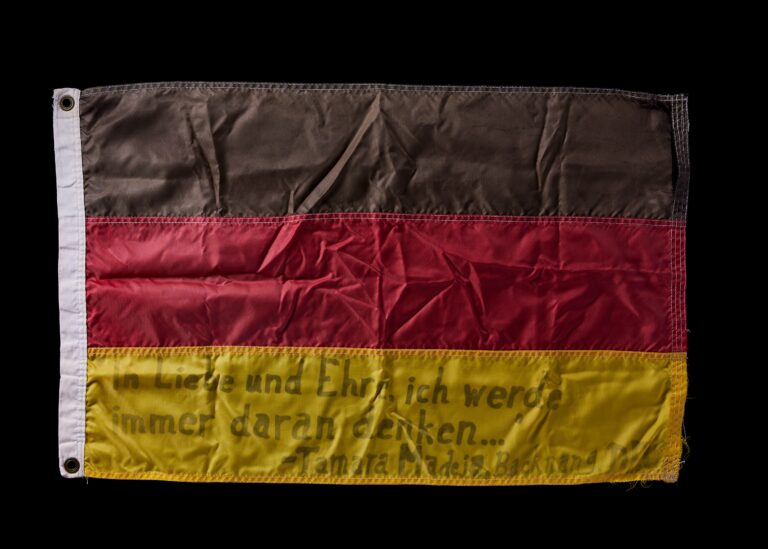 German Flag with Message Written on It